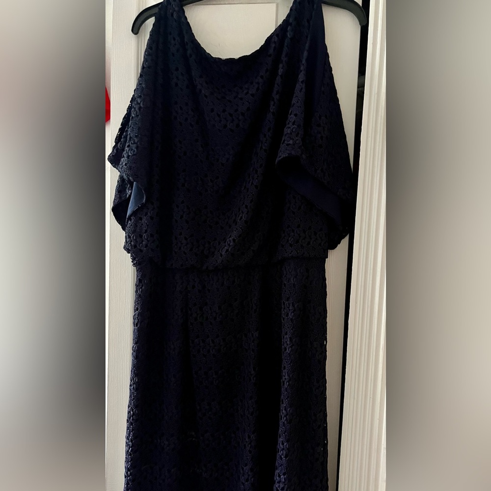 Navy lace dress with tie sleeves.